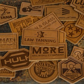 Full-Grain Leather Patch w/Adhesive Back Medium (<10 Square Inches) with Logo  Full-Grain Leather Patch w/Adhesive Back Medium (<10 Square Inches) with Logo