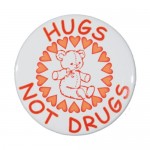 Logo Printed 1" Stock Celluloid "Hugs Not Drugs" Button