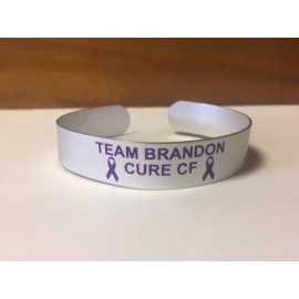 Aluminum cuff bracelet (5.5" x 1/2" wide) with a screen printed imprint. Made in the USA Logo Printed  Aluminum cuff bracelet (5.5" x 1/2" wide) with a screen printed imprint. Made in the USA Logo Printed