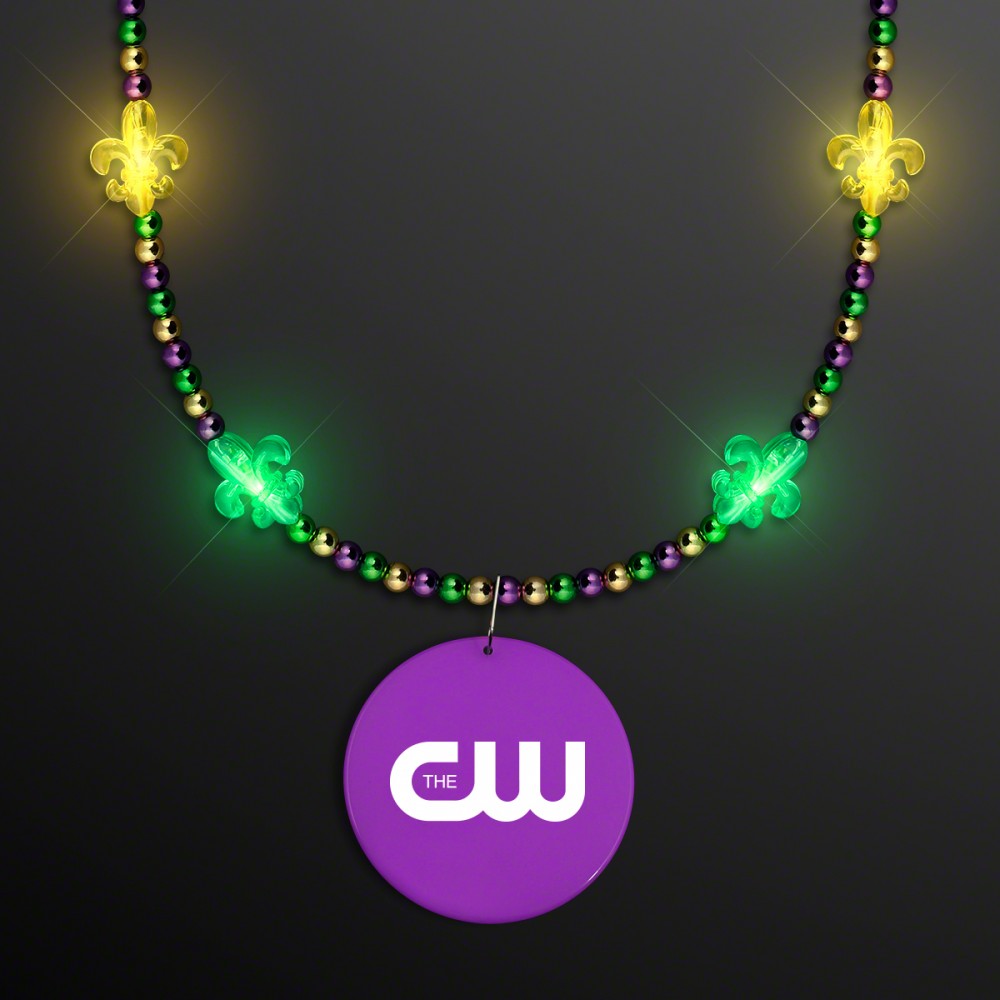 Custom Imprinted Light Up Fleur de Lis Jewelry with Purple Medallion Custom Imprinted Light Up Fleur de Lis Jewelry with Purple Medallion